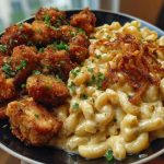 Garlic Butter Chicken Bites & Cajun Alfredo Mac with Crispy Onion Topping